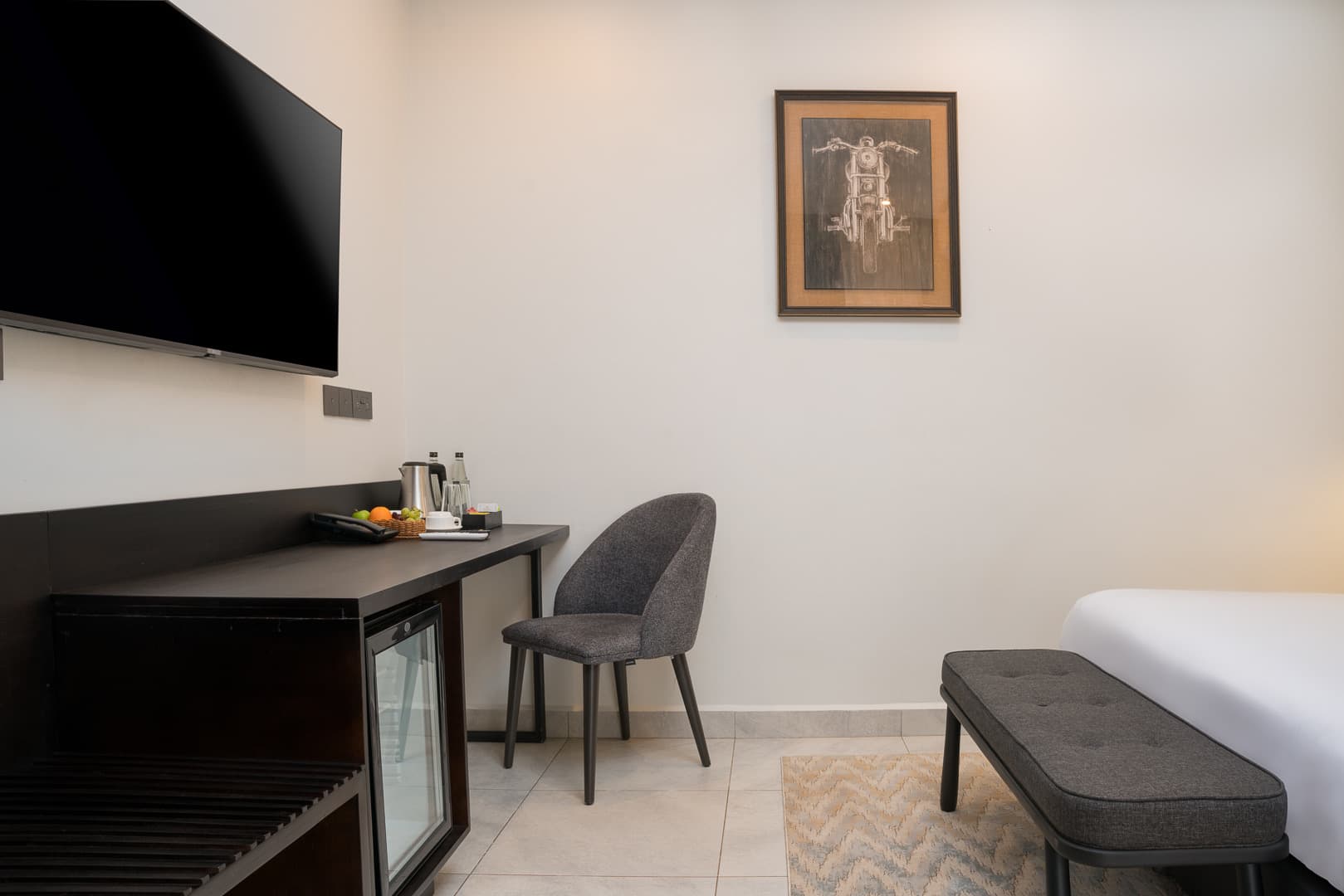 Junior Suite - entertainment area with smart TV and minibar