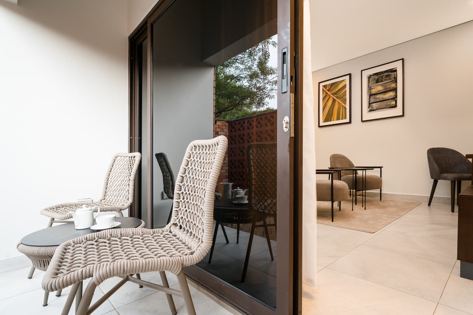 Junior Suite - balcony with woven chairs and tea set